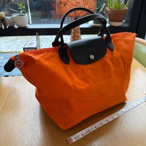 Longchamp Orange Tote with Black Trim and Handles